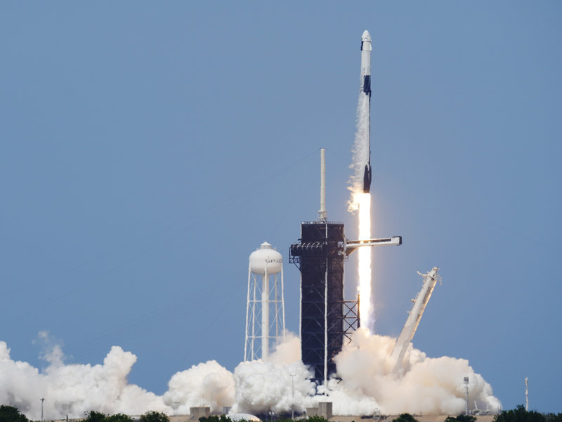 A SpaceX Falcon 9, with NASA astronauts Doug Hurley and Bob Behnken in the Dragon crew capsule, lifts off from Pad 39A at the Kennedy Space Center in Cape Canaveral, Fla., on Saturday. David J. Phillip/AP